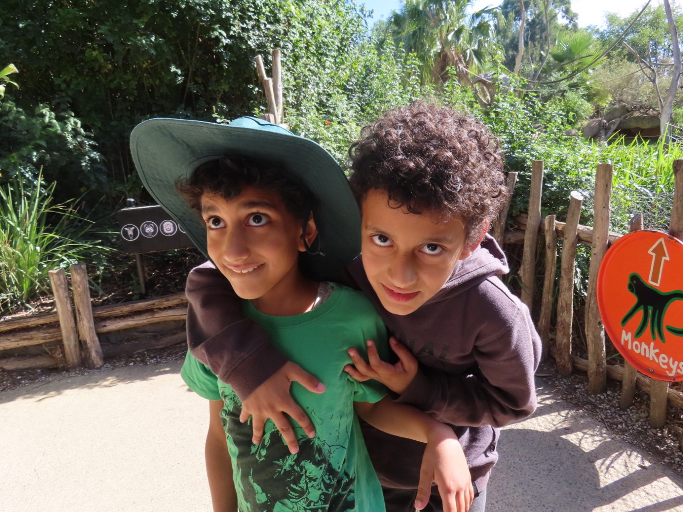 Two participants smiling together on a community outing